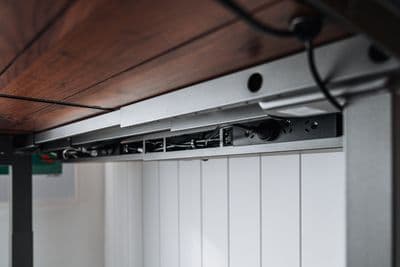 a close up of a metal and wood ceiling