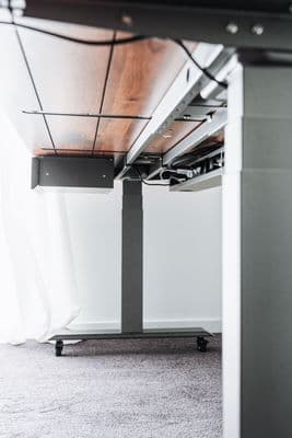 a desk with a wooden top and metal legs