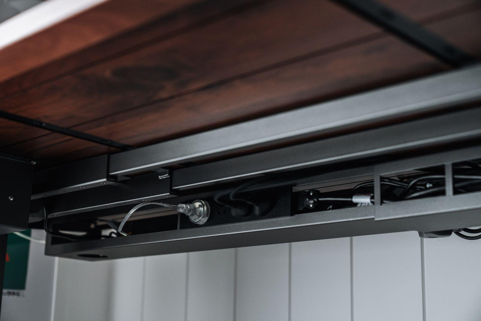 a close up of a metal and wood shelf