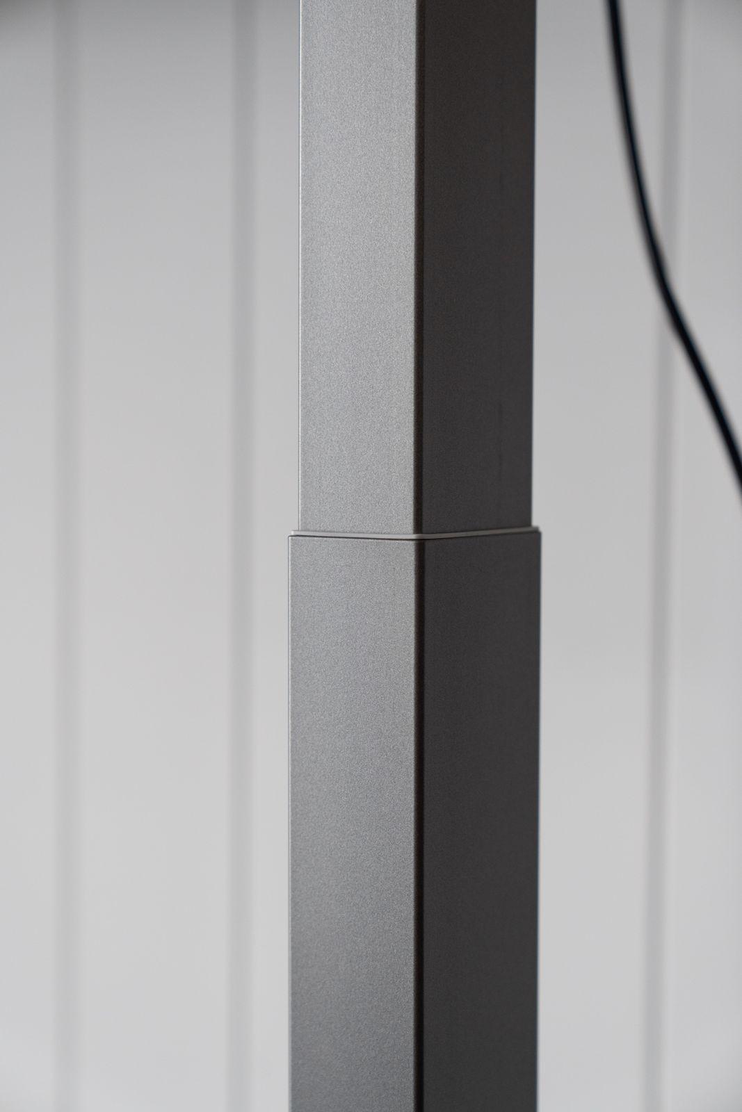 a black and white photo of a metal pole