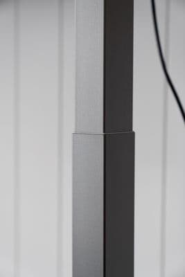 a black and white photo of a metal pole