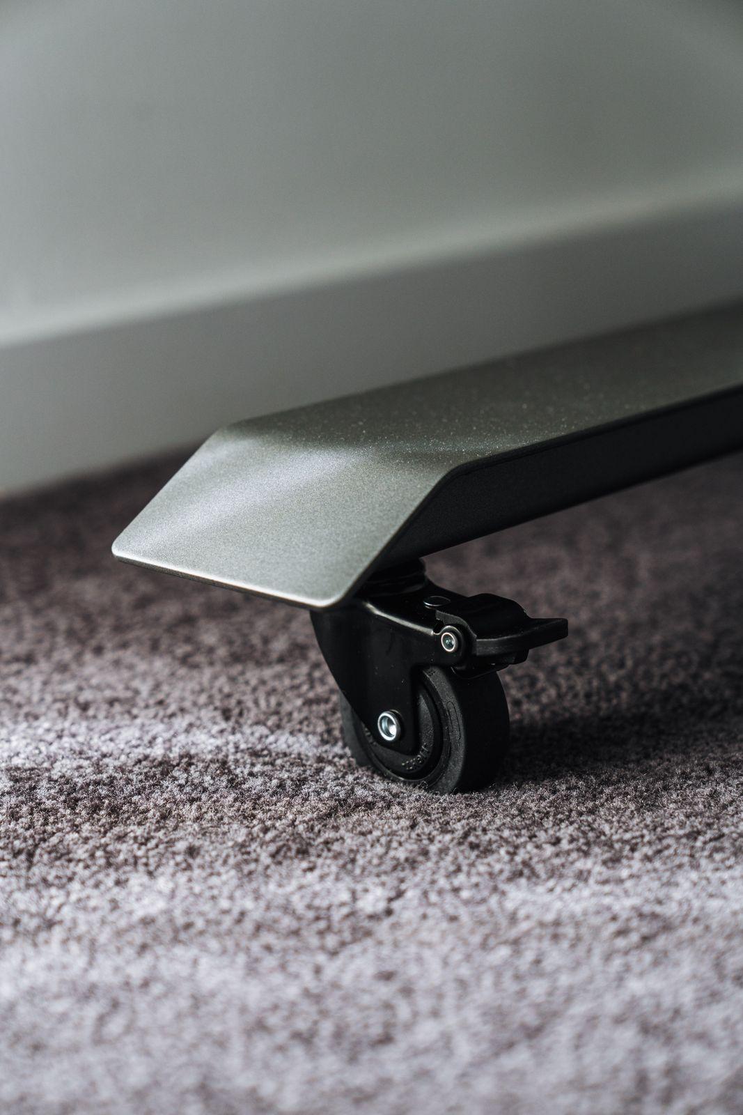 a close up of a skateboard on a carpeted floor