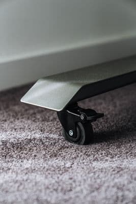 a close up of a skateboard on a carpeted floor