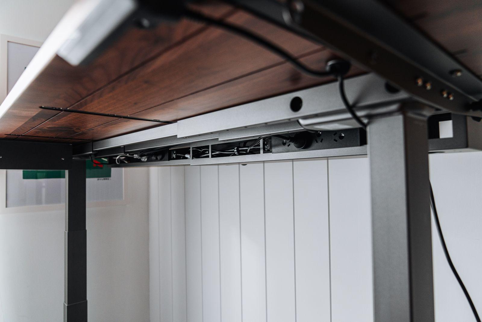 a close up of a metal and wood shelf