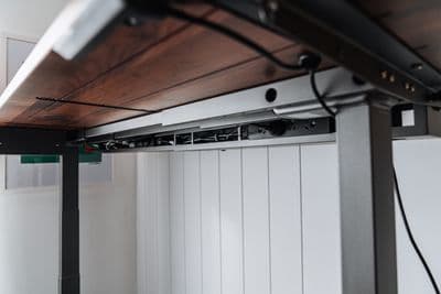 a close up of a metal and wood shelf