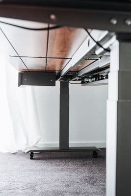 a computer desk with a laptop on top of it