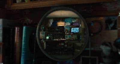 a magnifying glass with a reflection of a dining room