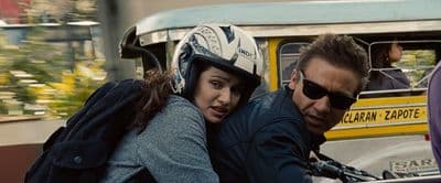 a man and a woman on a motorcycle