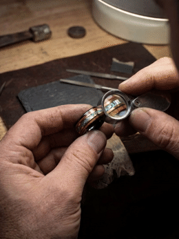a man holding a pair of scissors in his hands