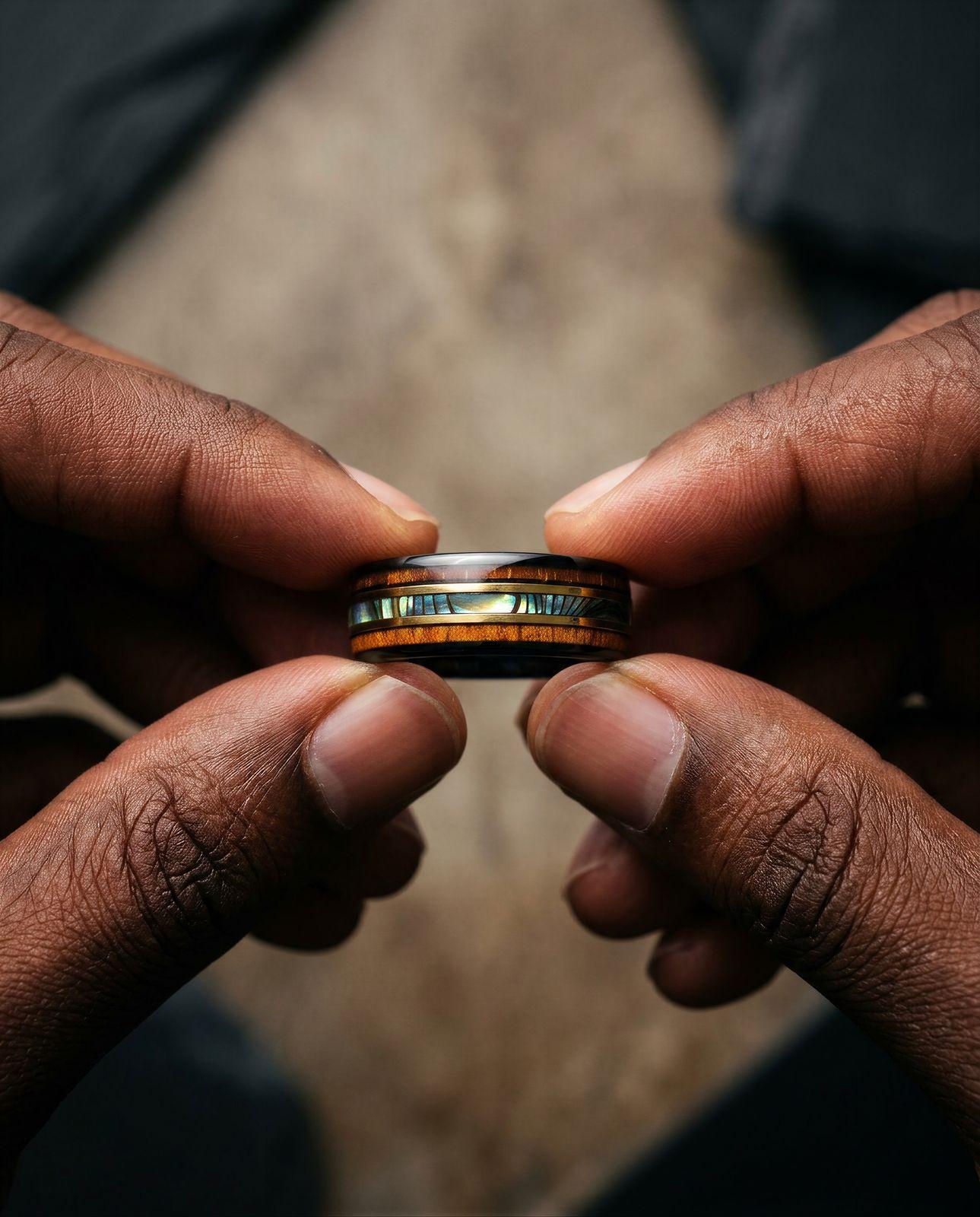 a man holding a ring in his hands