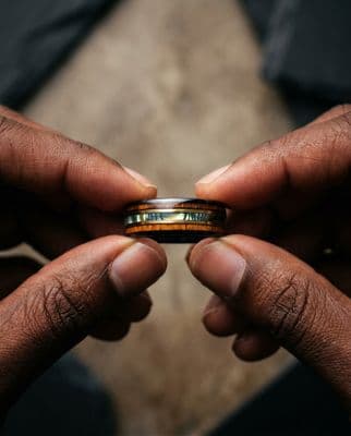 a man holding a ring in his hands