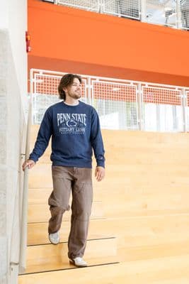 a man walking up a flight of stairs