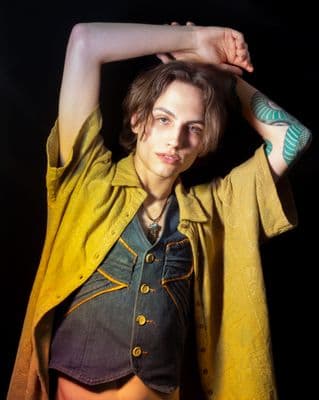 a woman with a tattoo on her arm