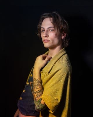 a woman with a tattoo on her arm