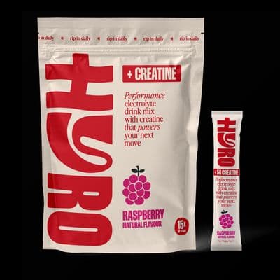 a bag of raspberry flavor next to a bag of creatin