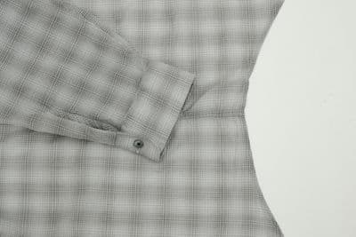 a close up of a shirt on a white surface