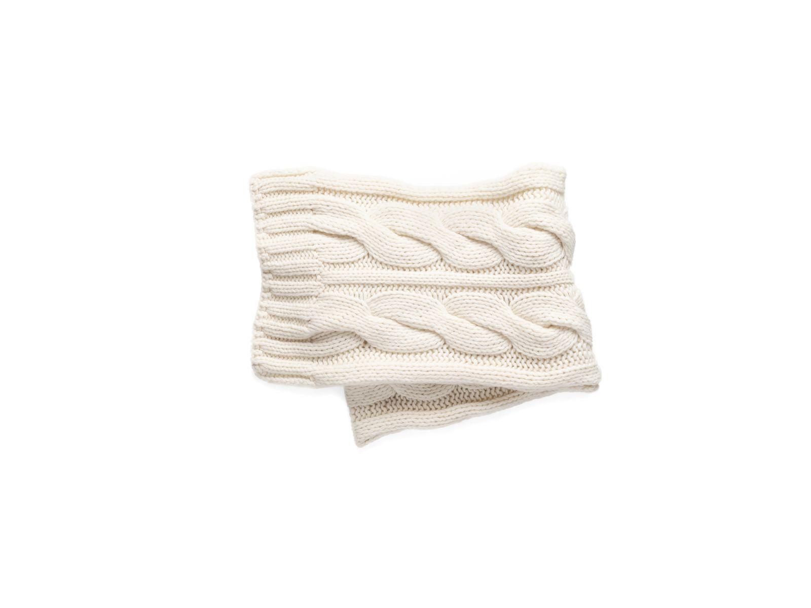 a white knitted scarf on a white background
