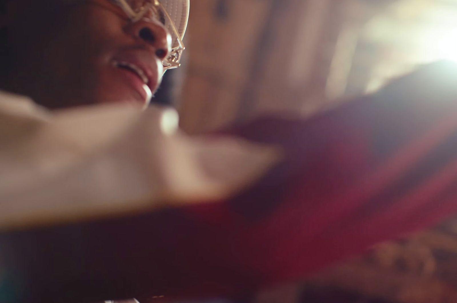 a close up of a person wearing glasses