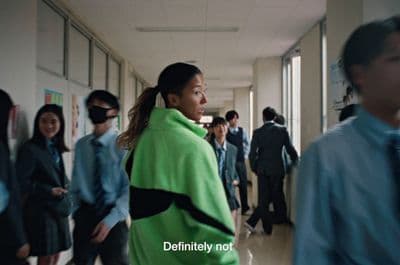 a group of people walking down a hallway