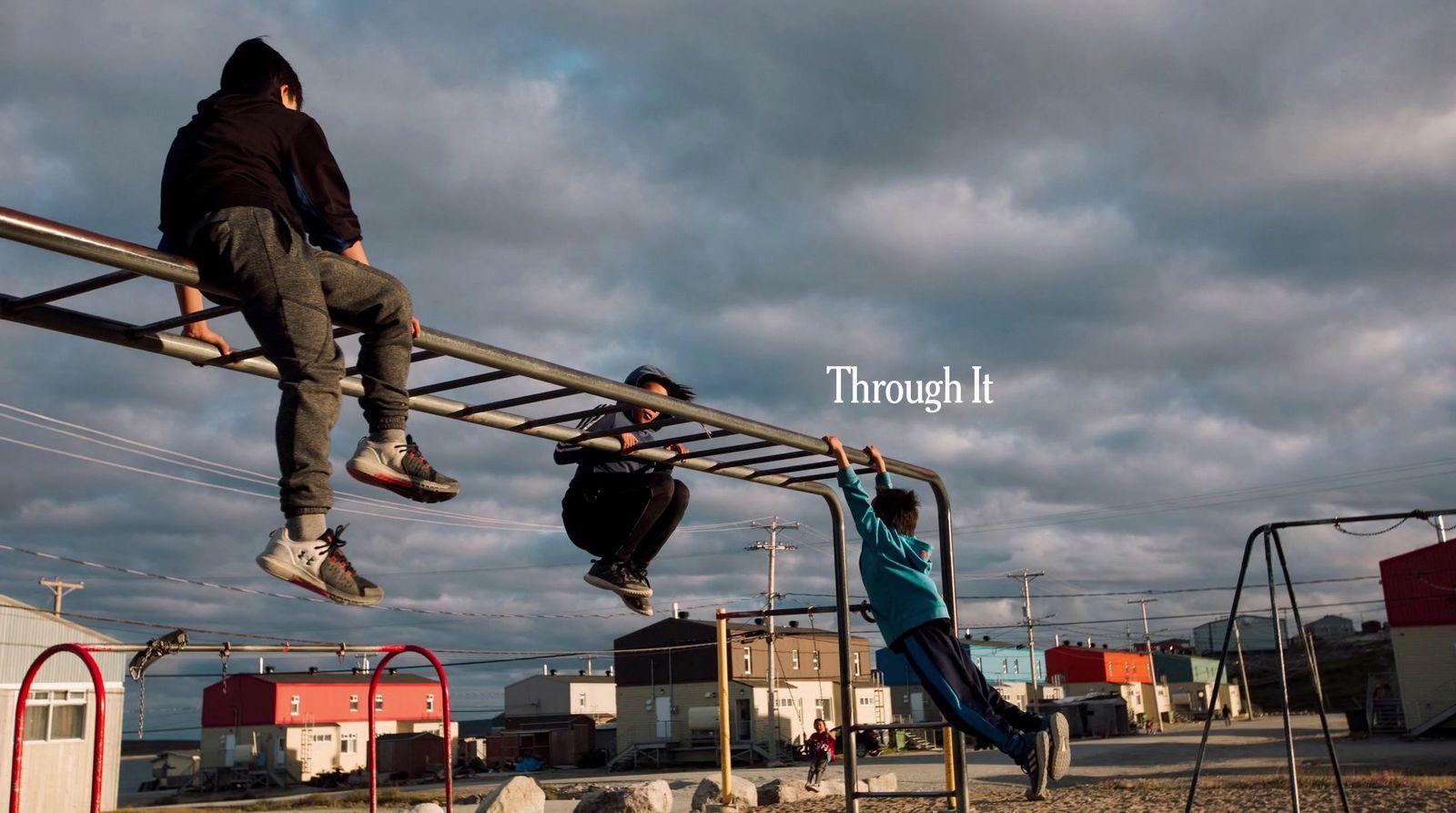 a man riding a skateboard down a metal rail