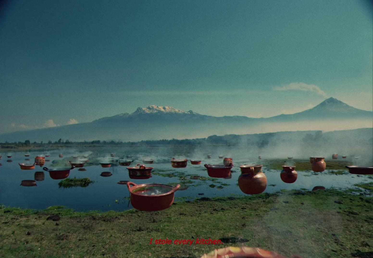 a group of pots sitting on top of a grass covered field