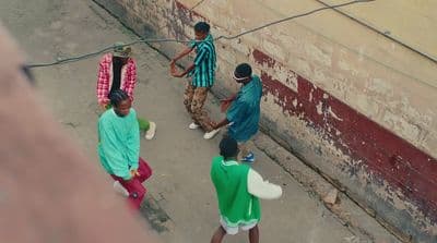 a group of people walking down a street