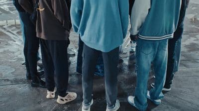 a group of young men standing next to each other
