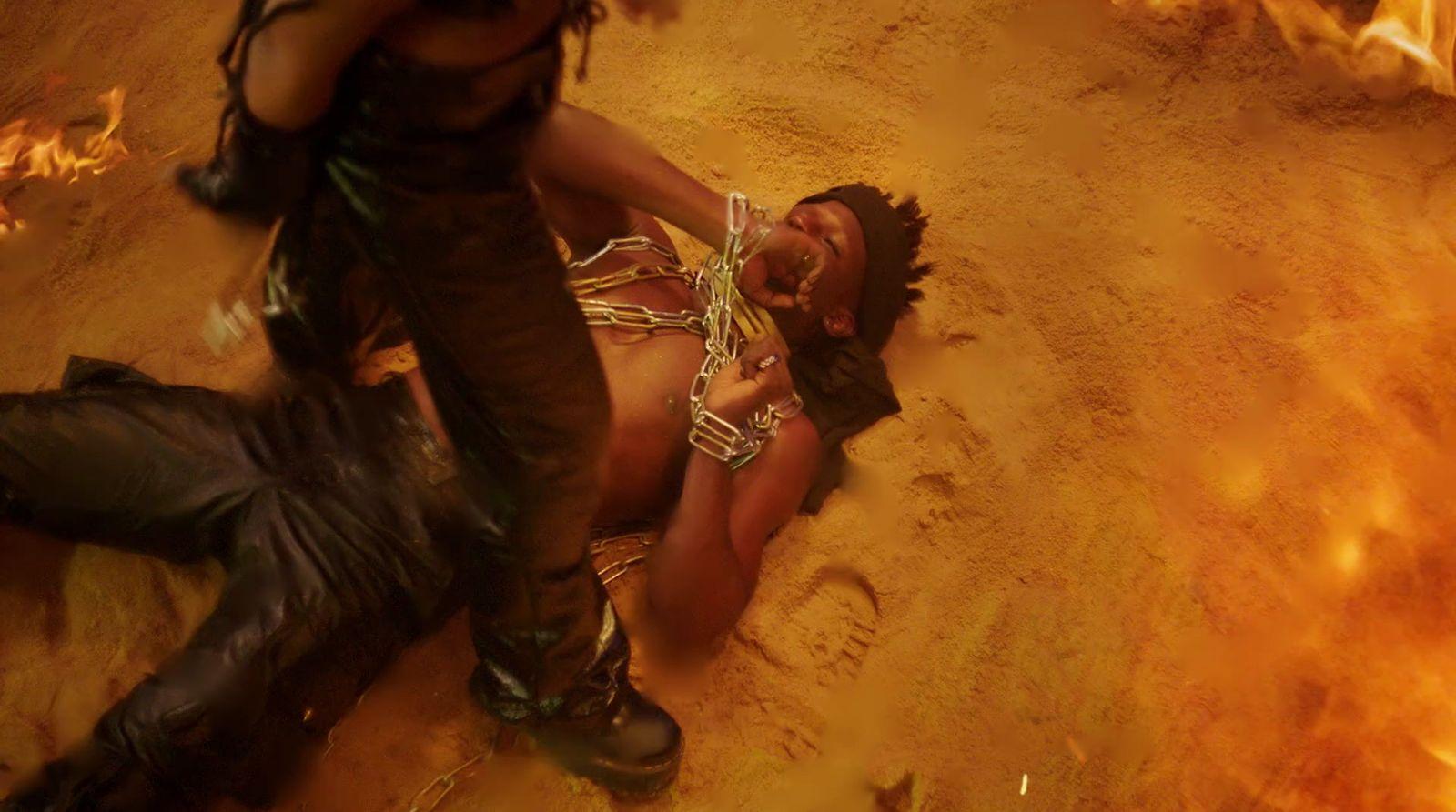 a woman laying on the ground in a costume