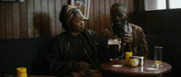 a man and a woman sitting at a table