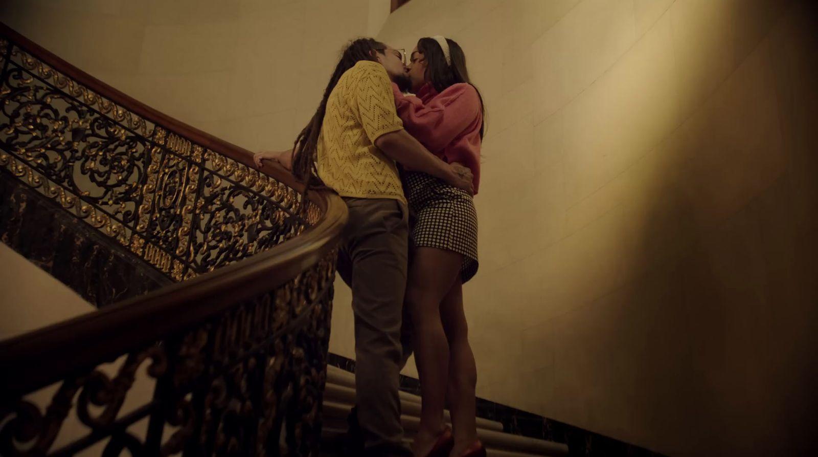 a couple of people that are standing on some stairs