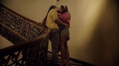 a couple of people that are standing on some stairs
