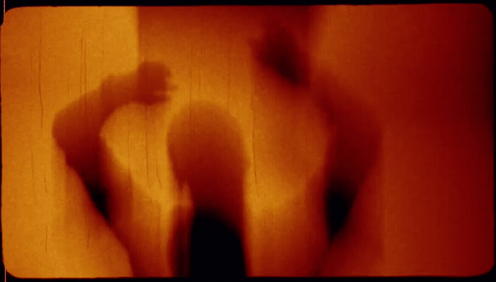 a blurry image of a person standing in a room