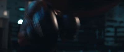 a blurry photo of a person wearing boxing gloves