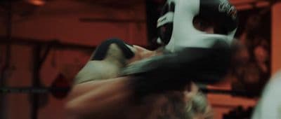 a blurry photo of a man in a boxing ring
