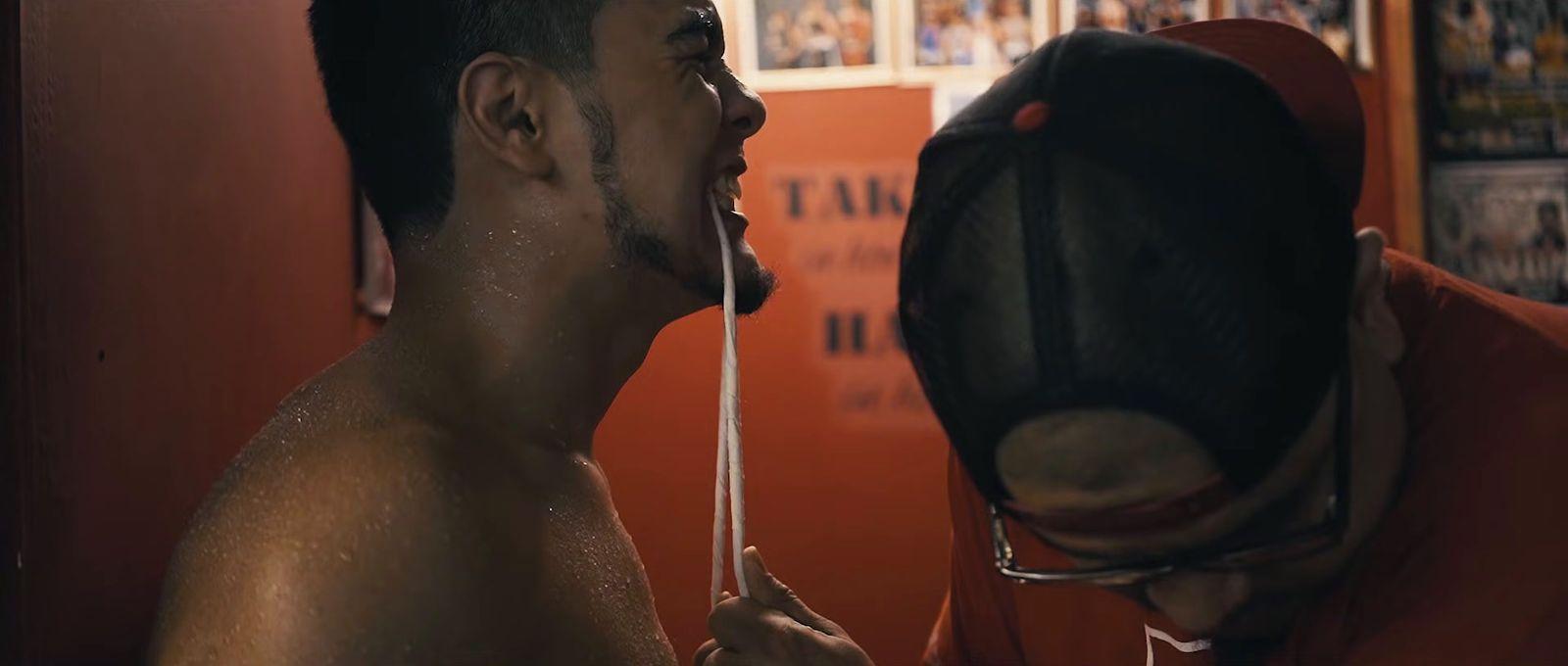 a shirtless man with his mouth open and tongue out