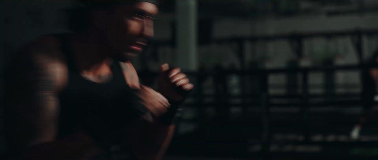 a man in a black tank top and a woman in a black tank top