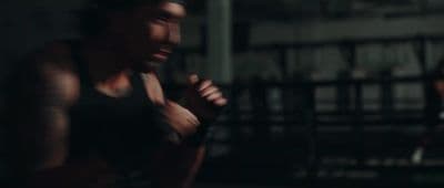 a man in a black tank top and a woman in a black tank top