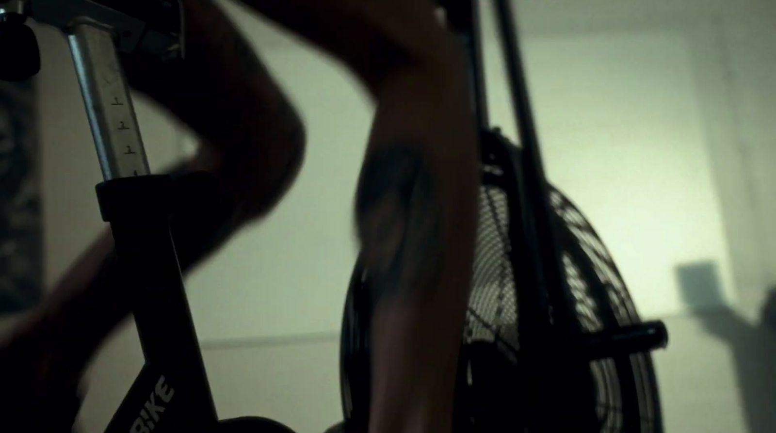 a close up of a person on a stationary bike