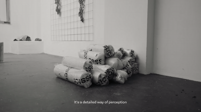 a pile of rolls of toilet paper sitting in a room
