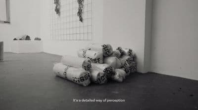 a pile of rolls of toilet paper sitting in a room