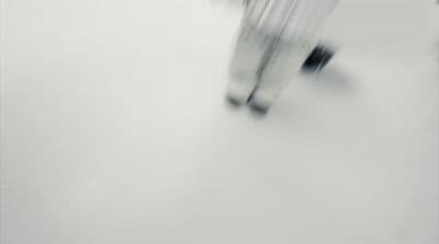a blurry photo of a person walking in the snow