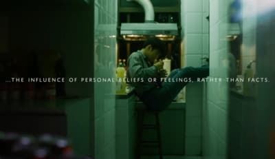 a man leaning on a ladder in a kitchen