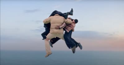 a couple of people that are jumping in the air