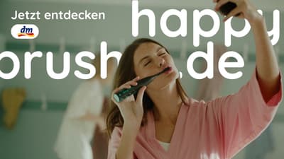 a woman holding a cell phone up to her ear