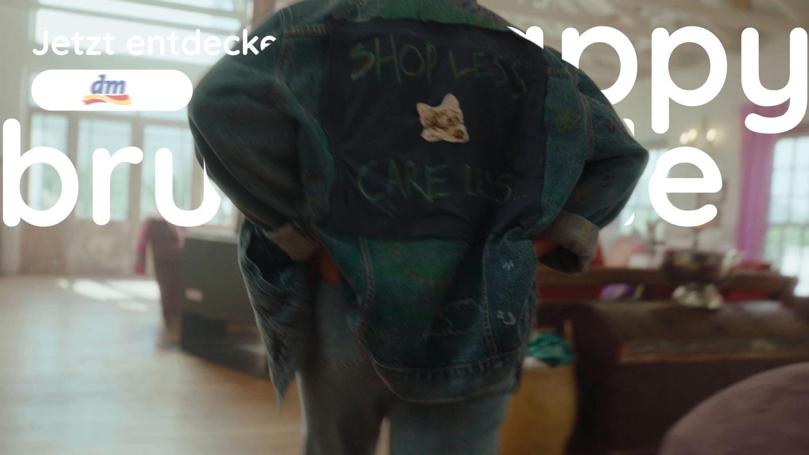 the back of a person wearing a jacket with writing on it
