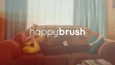 a man laying on top of a couch next to a window