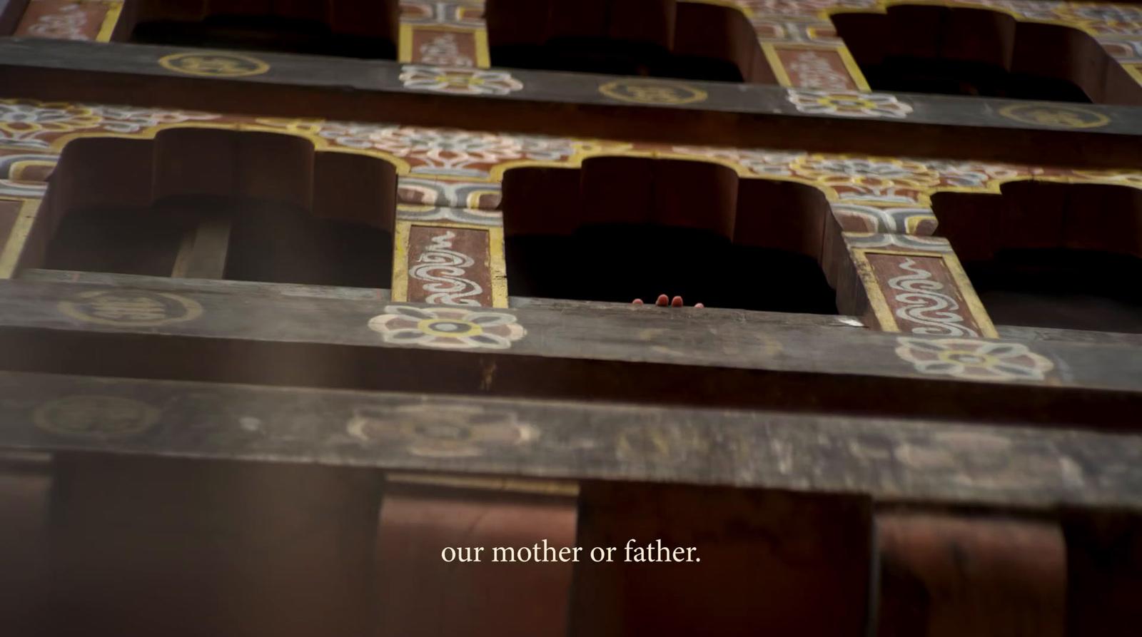 a close up of a wooden structure with ornate designs
