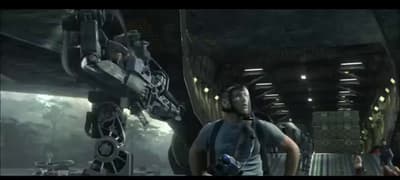 a group of people standing in front of a giant robot