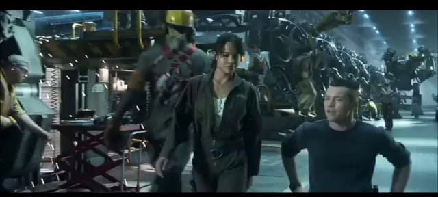 a group of people walking around a building