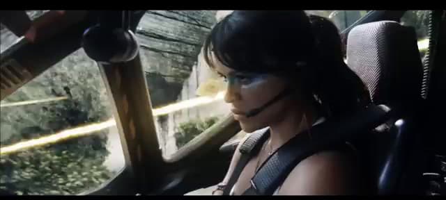 a woman wearing a headset sitting in a car